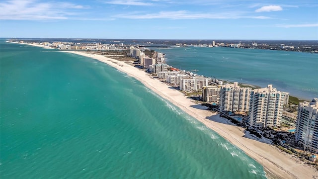 aerial view featuring a view of the beach, a view of city, and a water view