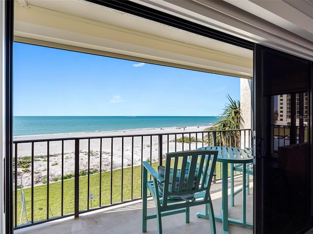 balcony with a view of the beach and a water view