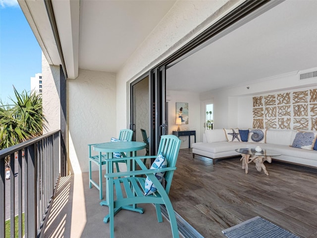 balcony featuring visible vents and outdoor lounge area