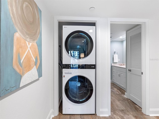 laundry room featuring laundry area and stacked washing maching and dryer