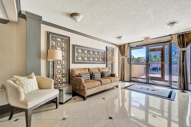 living room featuring light tile patterned floors, a textured ceiling, and ornamental molding