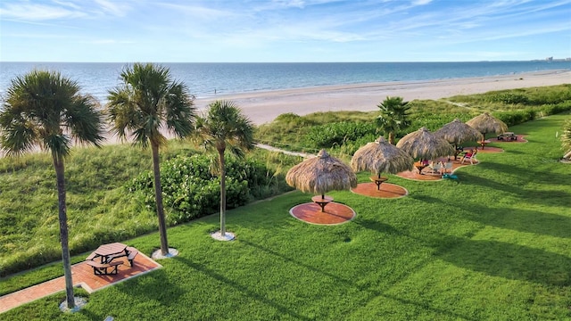 aerial view featuring a view of the beach and a water view