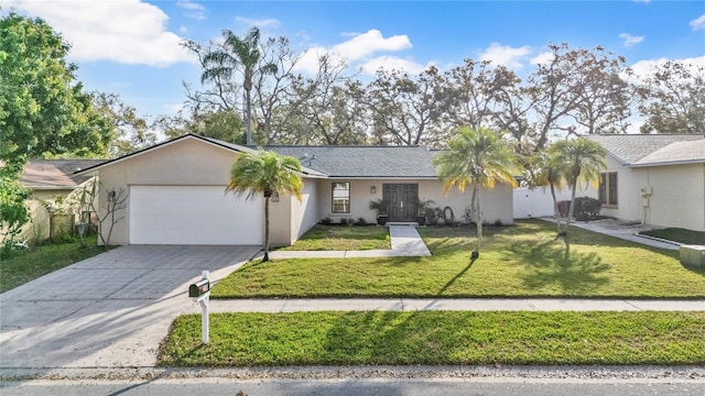 ranch-style home with a front lawn, concrete driveway, a garage, and stucco siding