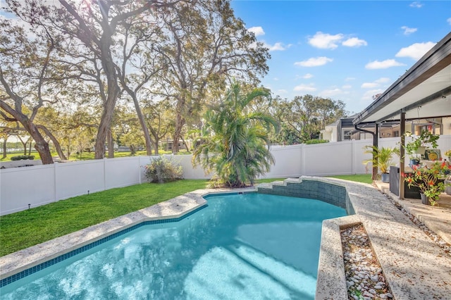 view of pool featuring a fenced in pool, a lawn, and a fenced backyard