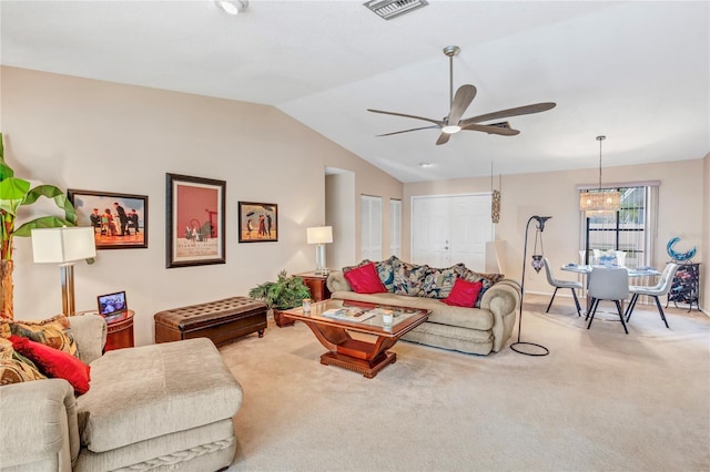 carpeted living room with visible vents, a ceiling fan, and vaulted ceiling