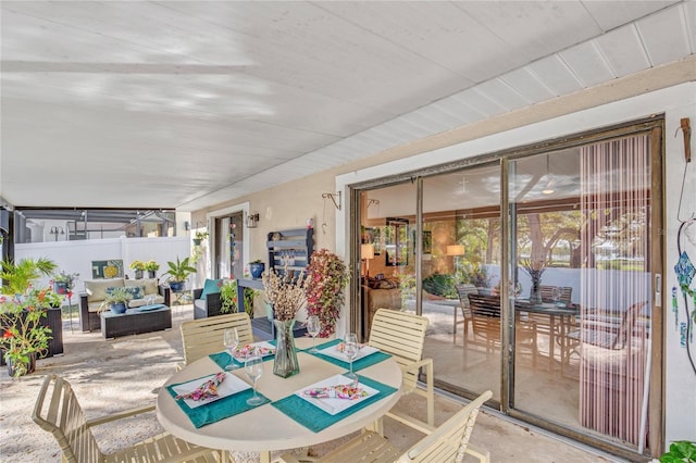 view of patio featuring an outdoor living space and fence