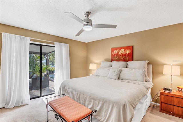 bedroom with a textured ceiling, ceiling fan, carpet flooring, and access to outside