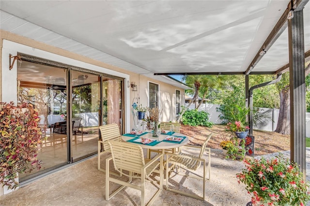 view of patio / terrace featuring outdoor dining space and fence