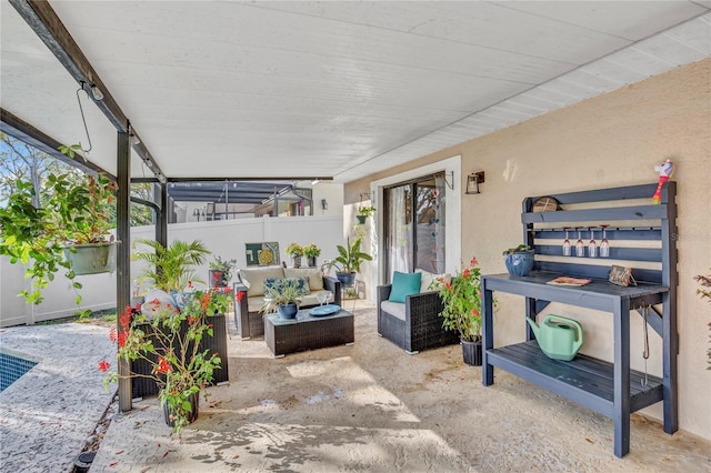 view of patio / terrace featuring outdoor lounge area and fence