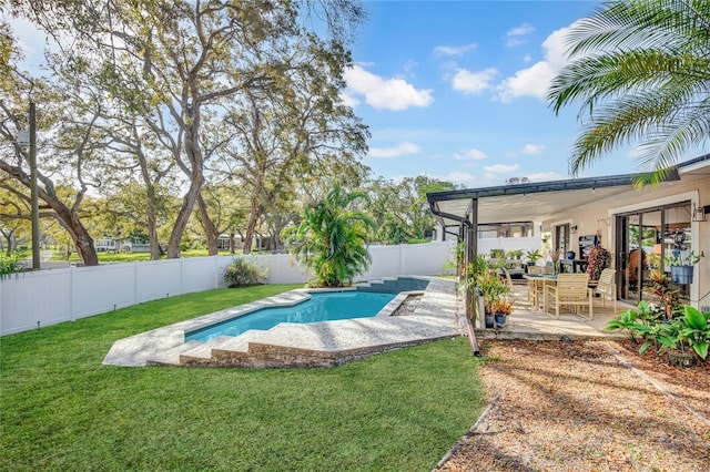 view of swimming pool featuring a yard, a patio area, a fenced in pool, and a fenced backyard