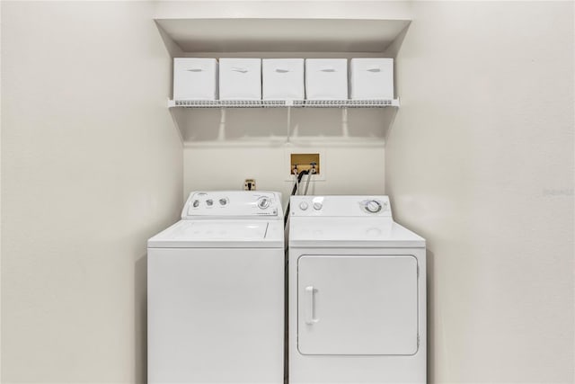 clothes washing area featuring laundry area and independent washer and dryer