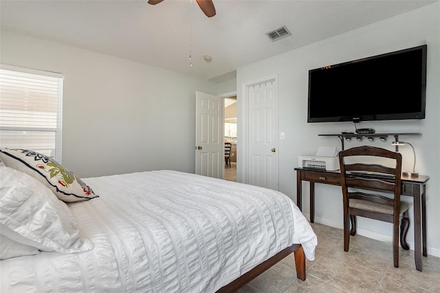 bedroom featuring visible vents, multiple windows, and a ceiling fan