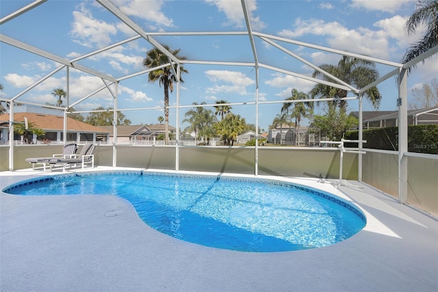 pool with a lanai and a patio