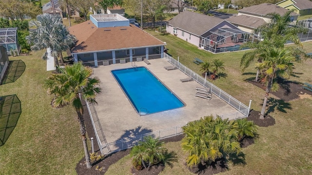 pool featuring glass enclosure and fence