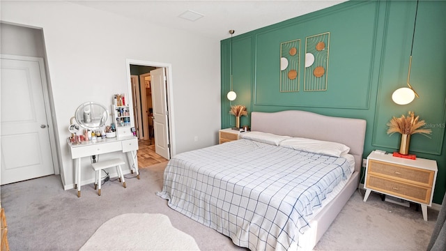 carpeted bedroom featuring baseboards