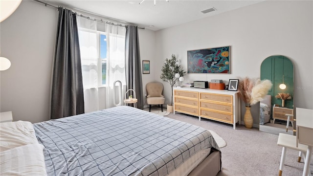 carpeted bedroom with visible vents