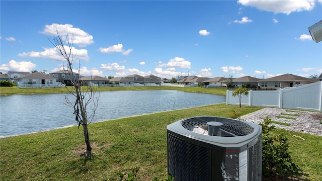 water view featuring a residential view and fence