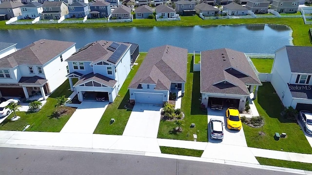 bird's eye view featuring a residential view and a water view