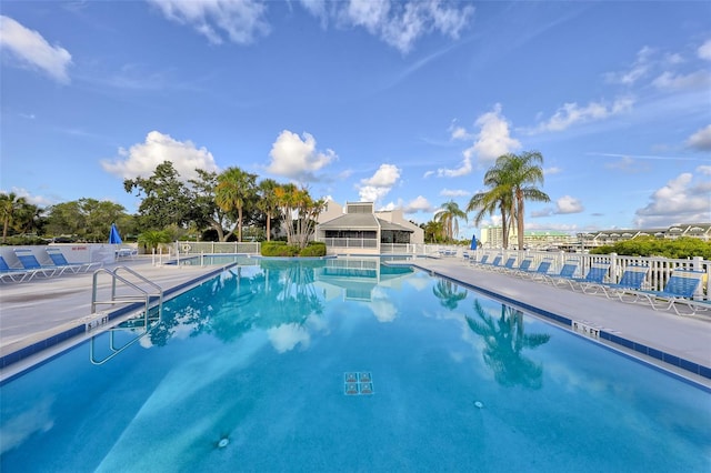 pool featuring a patio area and fence