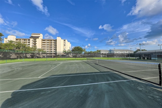 view of tennis court with fence