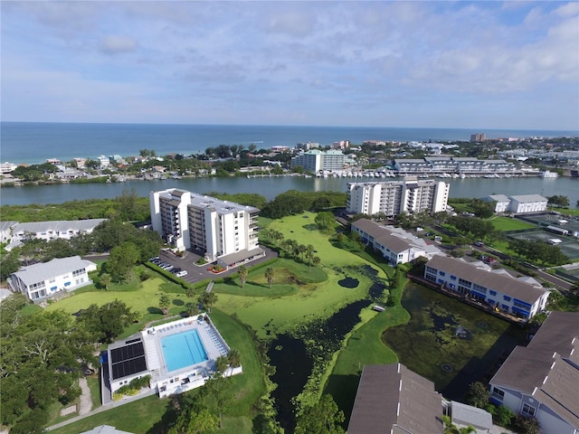 birds eye view of property with a water view