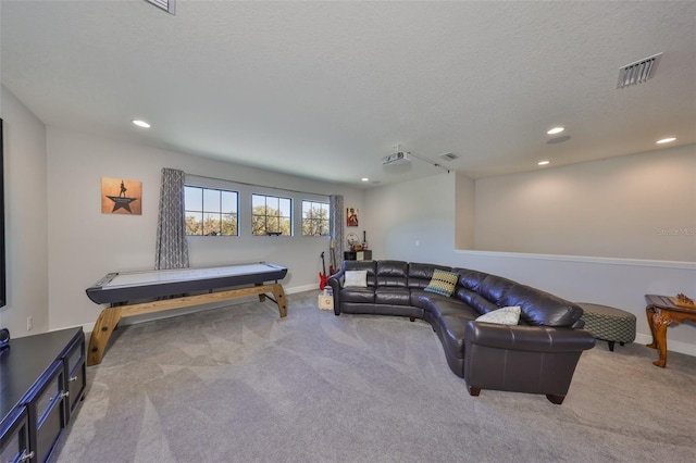 carpeted living room with recessed lighting, visible vents, and baseboards