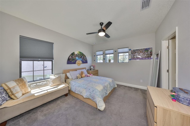 bedroom featuring baseboards, multiple windows, carpet floors, and visible vents