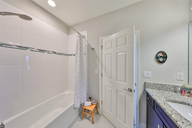 bathroom featuring shower / bath combo with shower curtain, vanity, and tile patterned flooring