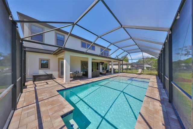 pool with a patio, a ceiling fan, an outdoor living space, and a lanai