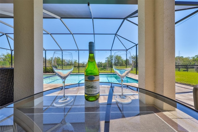 exterior details featuring a swimming pool and a sunroom