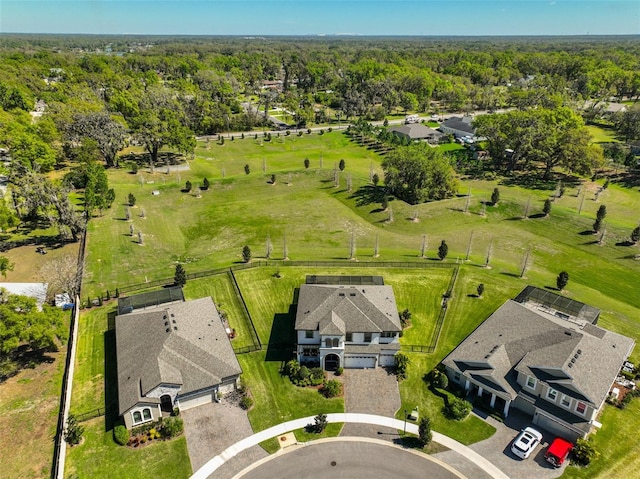 bird's eye view featuring a view of trees and a residential view