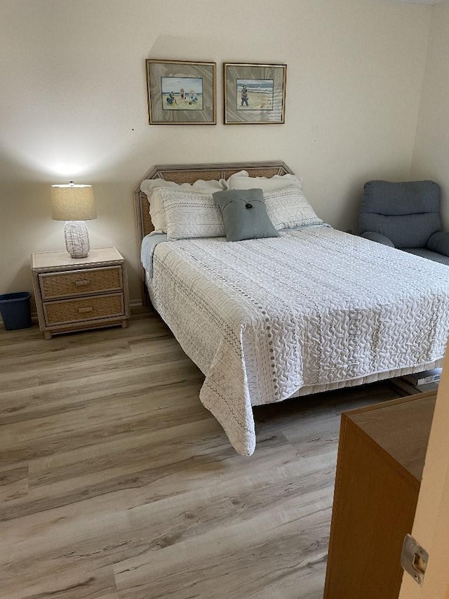 bedroom with wood finished floors