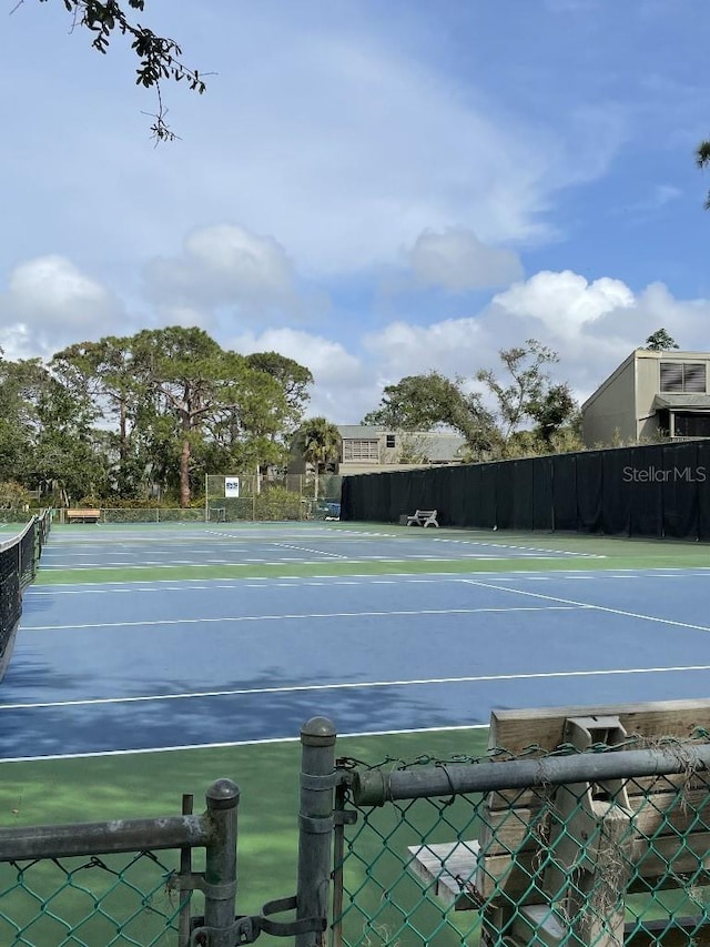 view of sport court with fence