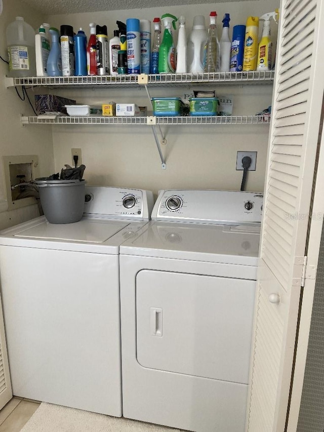 laundry area with laundry area and washer and clothes dryer