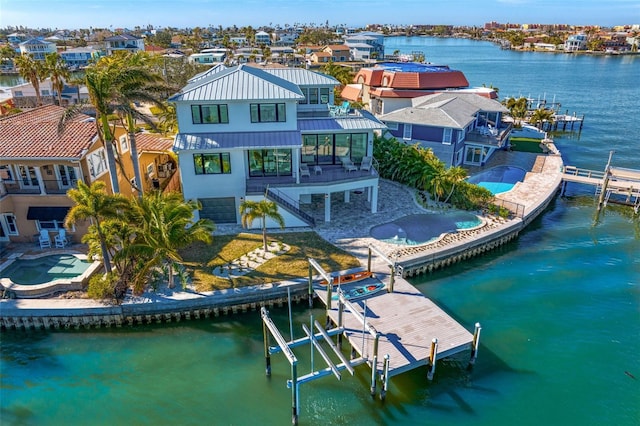 aerial view with a water view and a residential view