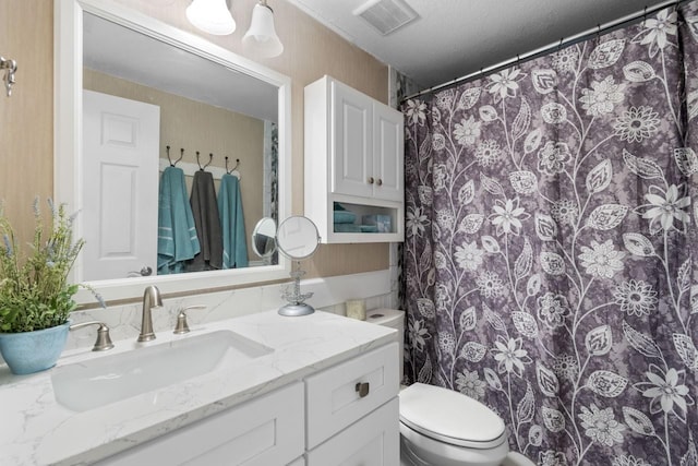 full bath featuring visible vents, toilet, and vanity