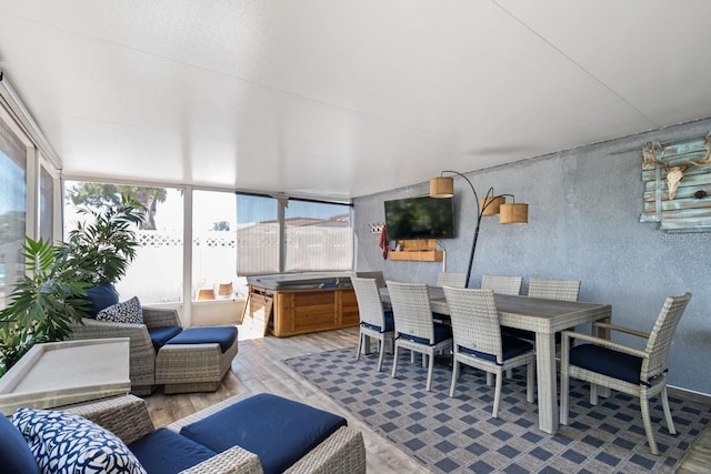 sunroom / solarium featuring a healthy amount of sunlight