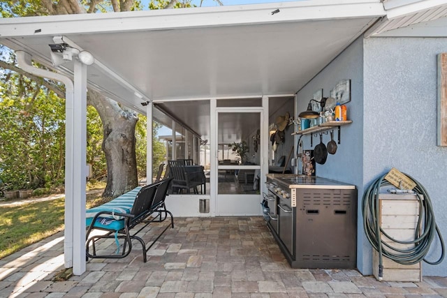 view of patio with a sunroom