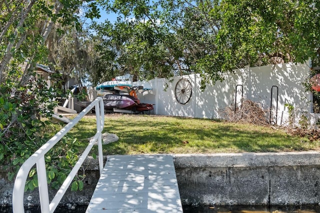 exterior space with a yard and fence