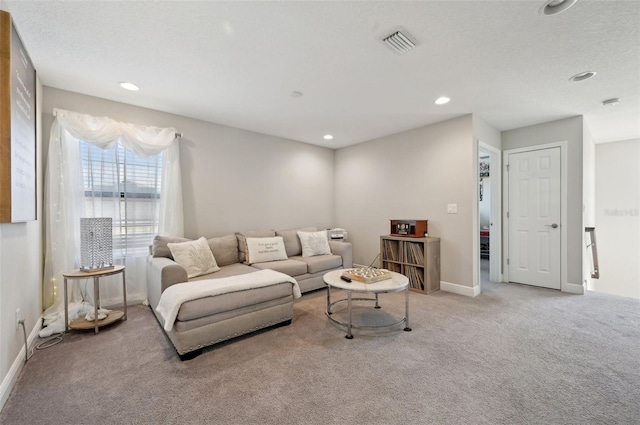 carpeted living room featuring recessed lighting, baseboards, and visible vents