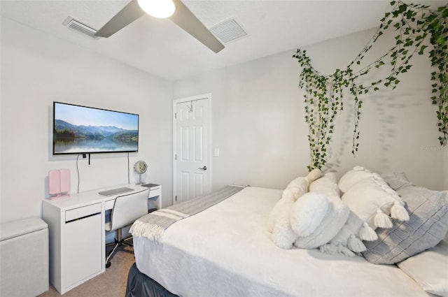 bedroom featuring light carpet, visible vents, and a ceiling fan