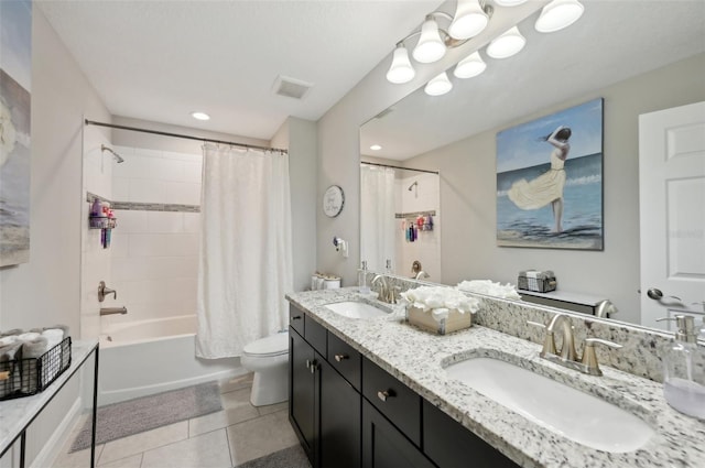 bathroom featuring tile patterned flooring, visible vents, toilet, and a sink