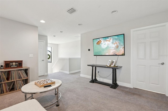 living area featuring visible vents, recessed lighting, baseboards, and carpet floors