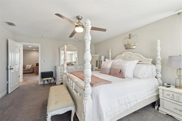 carpeted bedroom featuring baseboards, visible vents, a textured ceiling, and a ceiling fan