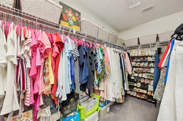 walk in closet with visible vents