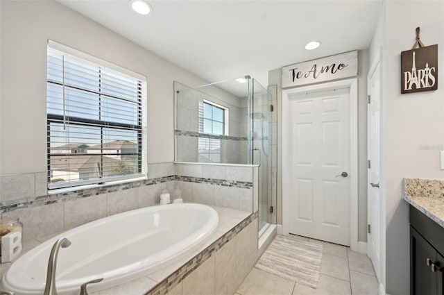 full bath featuring tile patterned flooring, a shower stall, a garden tub, recessed lighting, and vanity