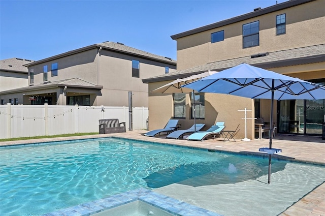 view of pool with a fenced in pool, a patio area, and fence