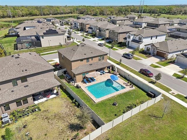 birds eye view of property with a residential view