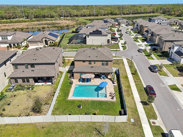 bird's eye view with a residential view and a water view