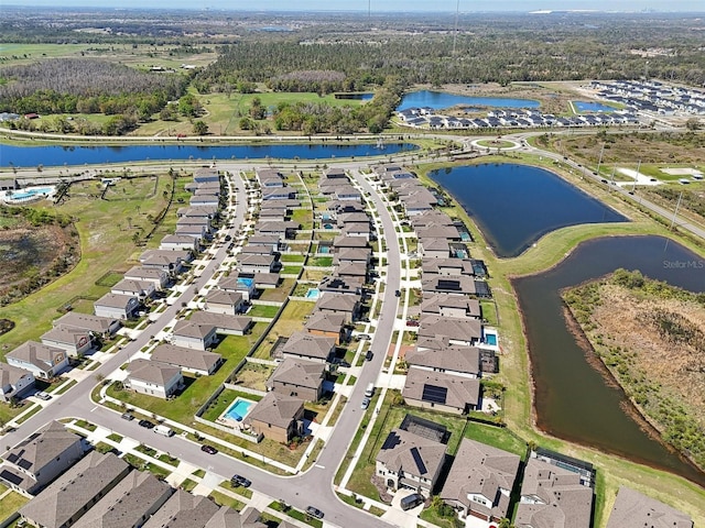 aerial view with a residential view and a water view